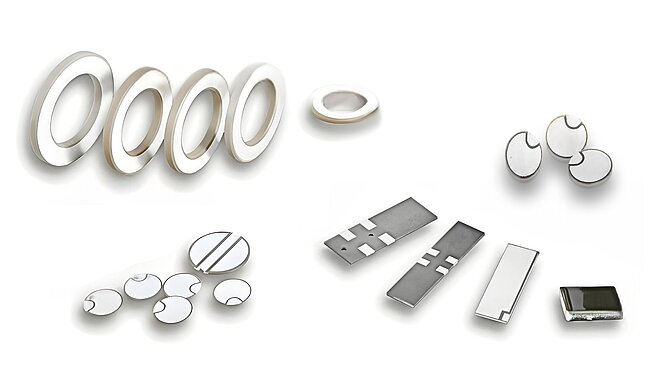 Various piezoceramic products and components for the automotive sector on a white background