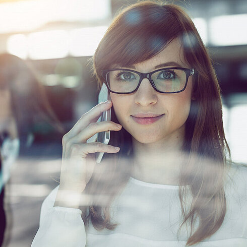 Woman smiling while talking on phone