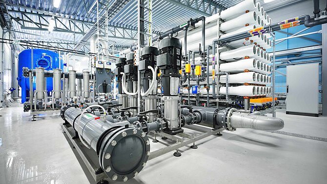 View into a factory hall with numerous pumps