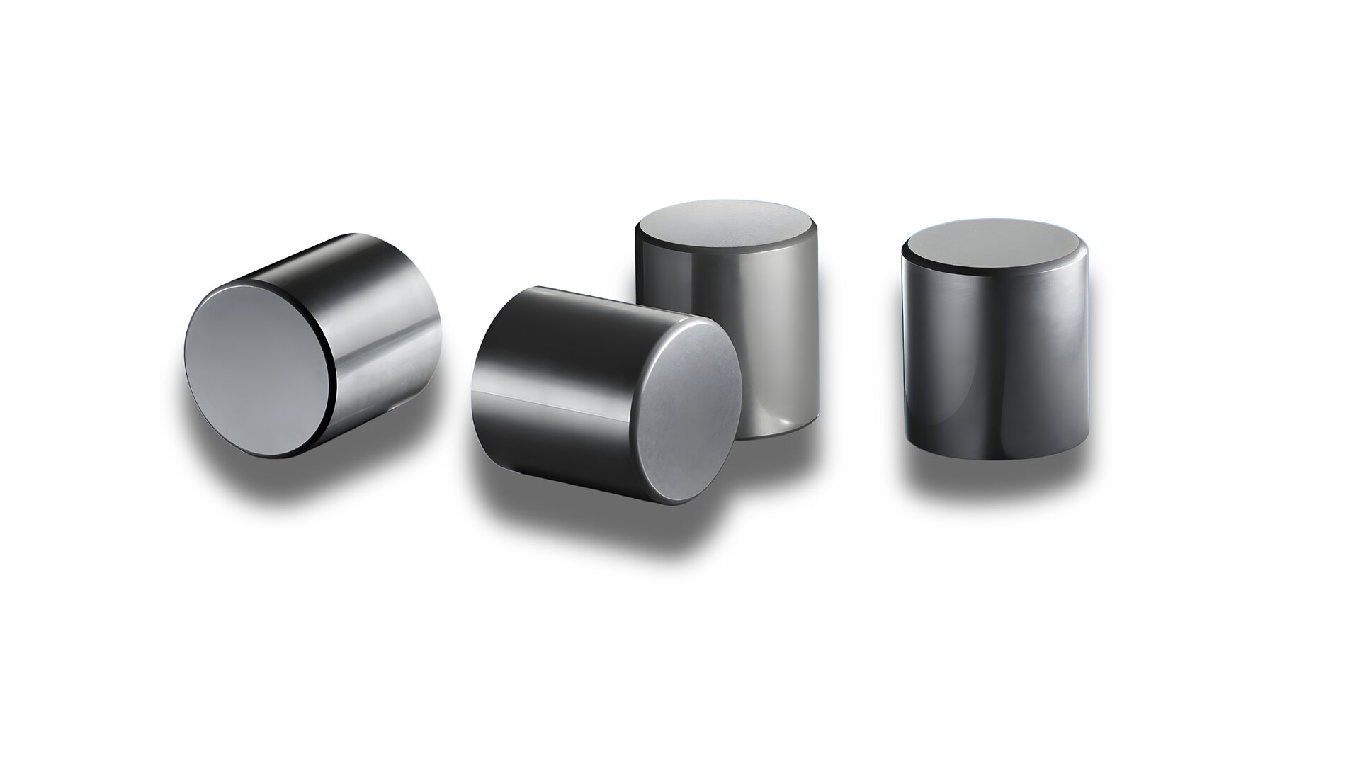 Four black rollers for the automotive sector on a white background